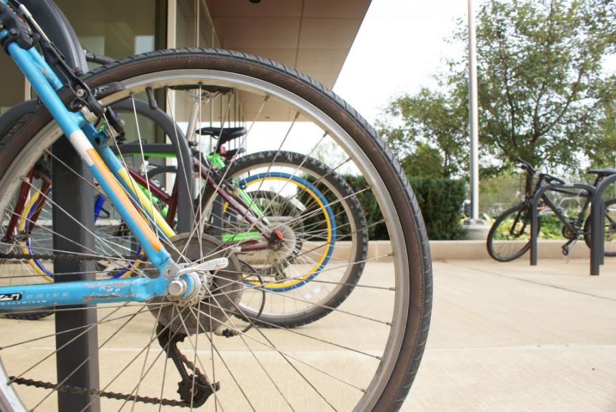 Bikes line up the racks near the Student Services Center of College of DuPage.