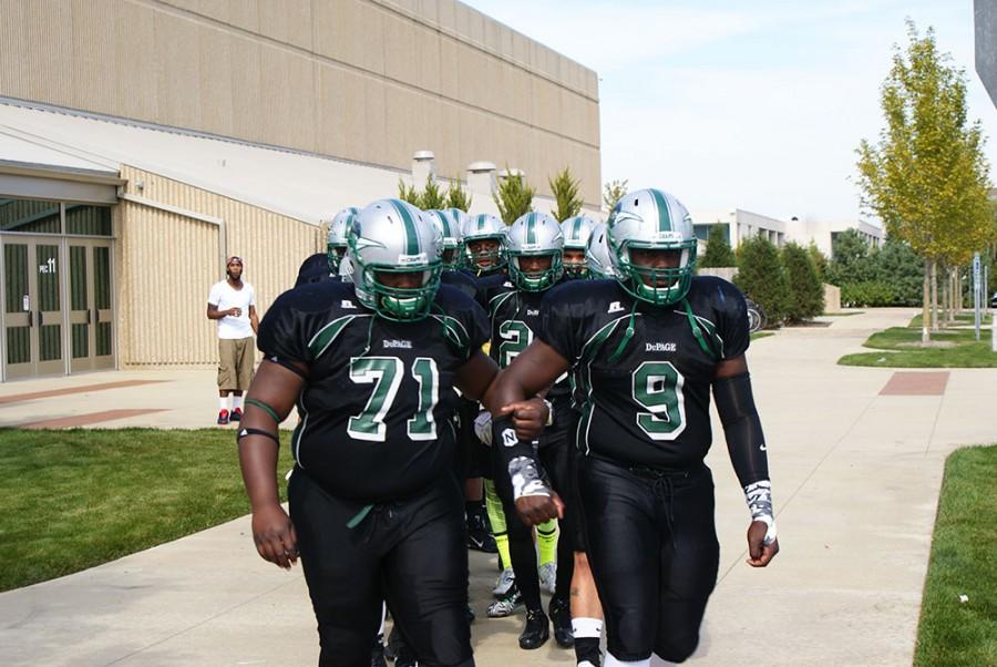 The Chaparrals exit the PE Center to head for the football field.