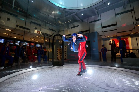 Courier features editor Kelly Wynne flies in a wind tunnel. Photo courtesy of iFLY.