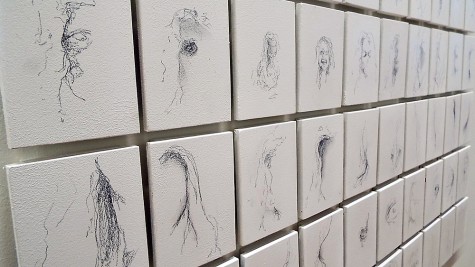 100 Minutes by Chuck Boone being displayed at the Cleve Carney Art Gallery in the Faculty Art Exhibit on Nov. 6, 2014. Each one of these 100 separate drawings were all done with a No. 2 pencil.