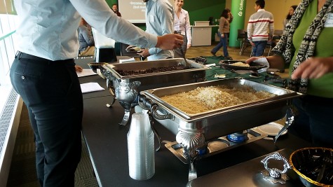 A group of people that are serving themselves rice and beans at the Oxfam Hunger Banquet on Nov. 7, 2014. 