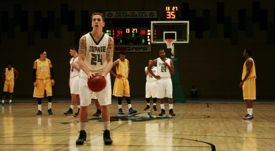 Chaparral Basketball player #24 Jonny Woolf taking a free throw after a personal foul at the College of DuPage’s basketball court on Dec. 4, 2014. The chaparrals won the game 84-53.