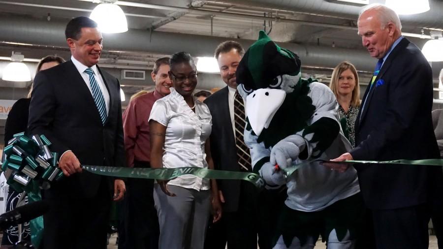 Chapie cutting the ribbon for the grand reopening of the College of DuPage Bookstore on March 10. 