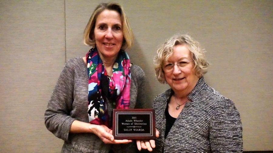 Sally Wiarda, left, is pictured with her award and her nominator, Charlotte Mushow. Wiard was named the Woman of Distinction by CODs Studies Committee.
