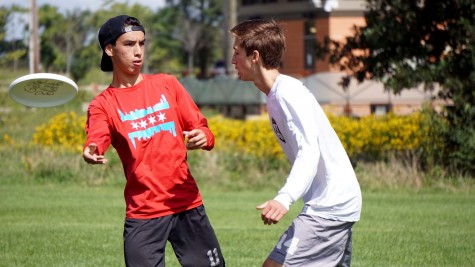 Jerry Kelly throws a disc past Alex Biskus during a game of Ultimate Frisbee at Knock Knolls Park in Naperville, Ill on Sept. 12.