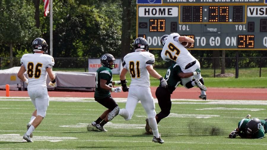 Defensive Back #29 Kyler Davis takes down University of Wisconsin Oshkosh player at the College of DuPage on Sept. 7.