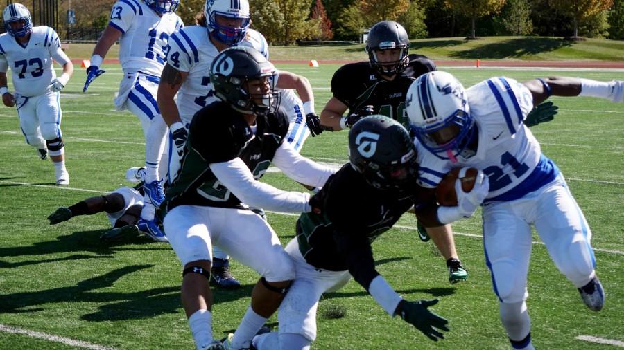 Chaparral player pushed Iowa Western Reiver running back Ray Gray at the College of DuPage Homecoming match on Oct. 17.