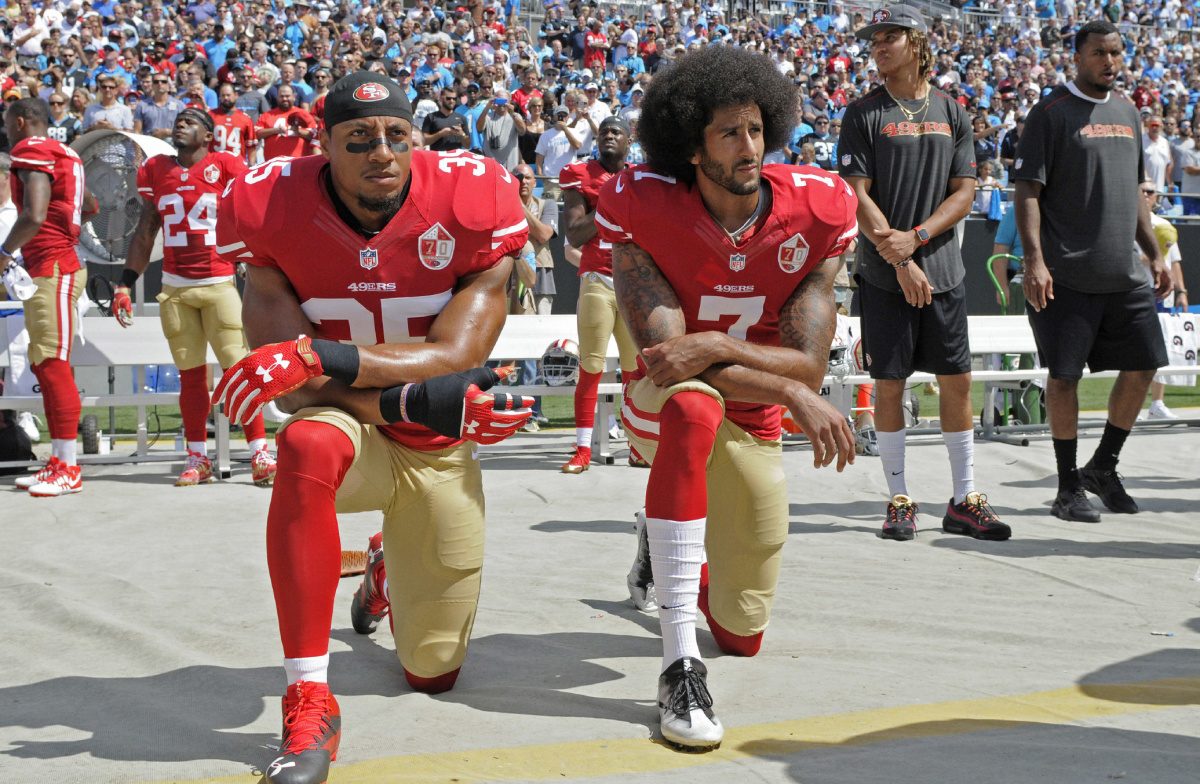 San Francisco 49ers Colin Kaepernick (7) and Eric Reid (35) kneel during the national anthem before an NFL football game against the Carolina Panthers in Charlotte, N.C., Sunday, Sept. 18, 2016. (AP Photo/Mike McCarn)