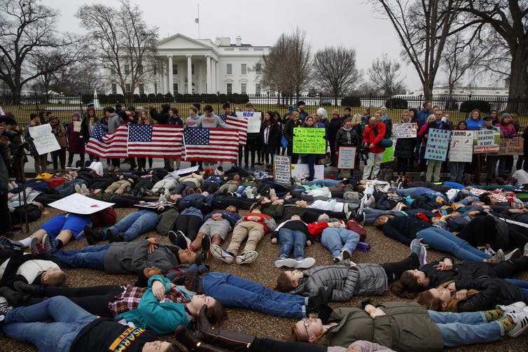 Demonstrators ‘lie-in’ during a protest in favor of gun control reform in front of the White House, on Feb. 19, 2018. 