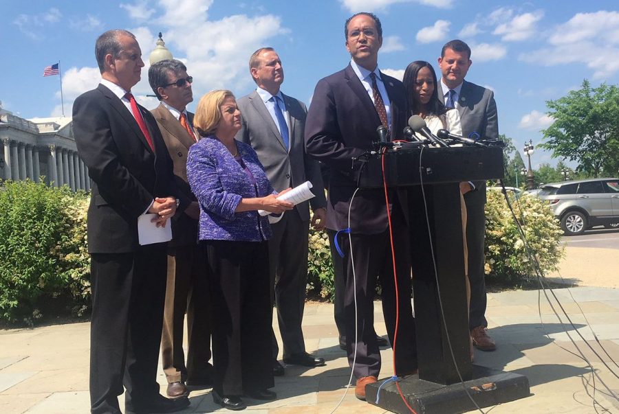 U.S. Rep Will Hurd, R-Helotes, center, speaks to reporters about an effort to force a debate on immigration legislation in the U.S. House, on May 9, 2018.  