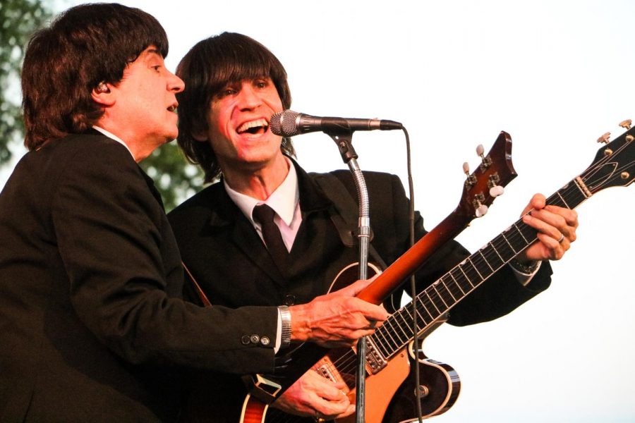 Photo by Alison Pfaff: Eric Michaels (left) (as Paul McCartney) and James Paul Lynch (right) (as George Harrison) of American English. The band uses vintage equipment like Michaels Hofner Beatle bass and Vox amps to get that classic Beatle sound.