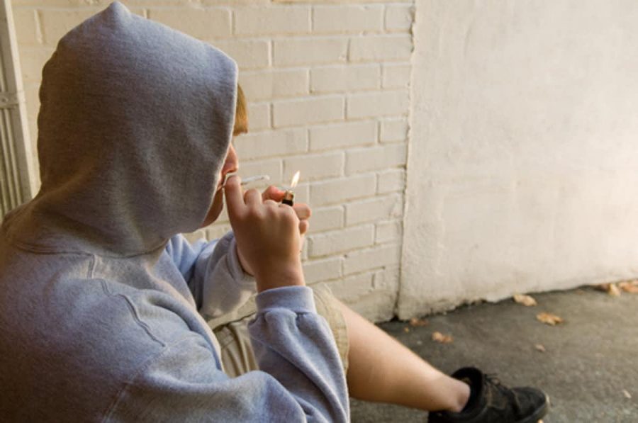  A teenager smokes a joint. Some teens in a recent study developed a marijuana use disorder. 