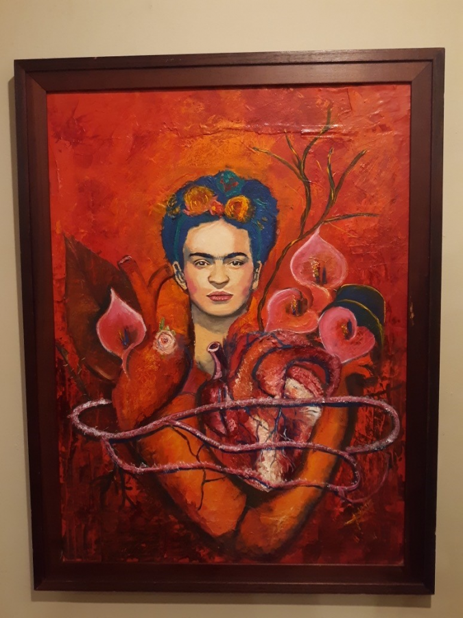 Arist Jade Nava paints Frida with two hearts to show how fearlessly she dared to love. The Alcatraz lilies are stained red with blood symbolizing the pain Diego brought her (photo by Sophia Rodriguez)