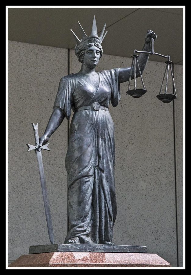 “Scales of Justice Brisbane Courts-1=” by Sheba Also 18 Million Views is licensed under CC BY-SA 2.0