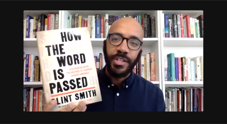 Clint Smith holds up his book How the Word Is Passed 