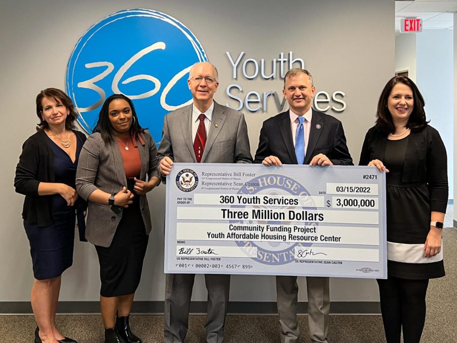 Rep. Bill Foster and Rep. Sean Casten present a check to 360 youth services.