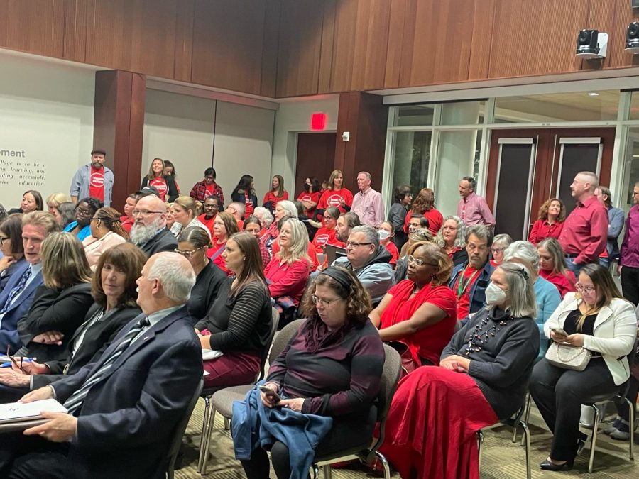 Faculty+dressed+in+red+at+the+board+meeting.+