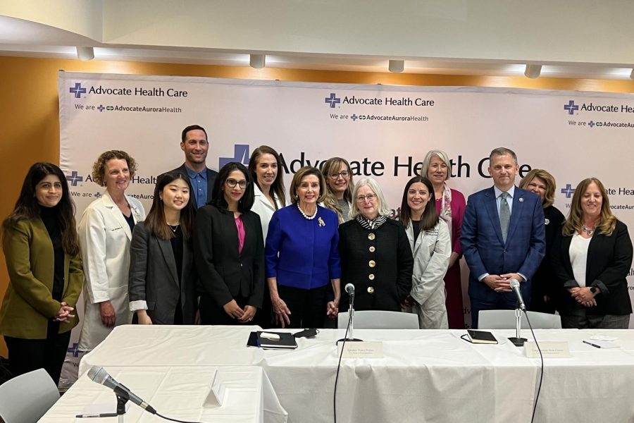 Nancy+Pelosi+and+Sean+Casten+take+a+photo+with+the+roundtable+panelists.+
