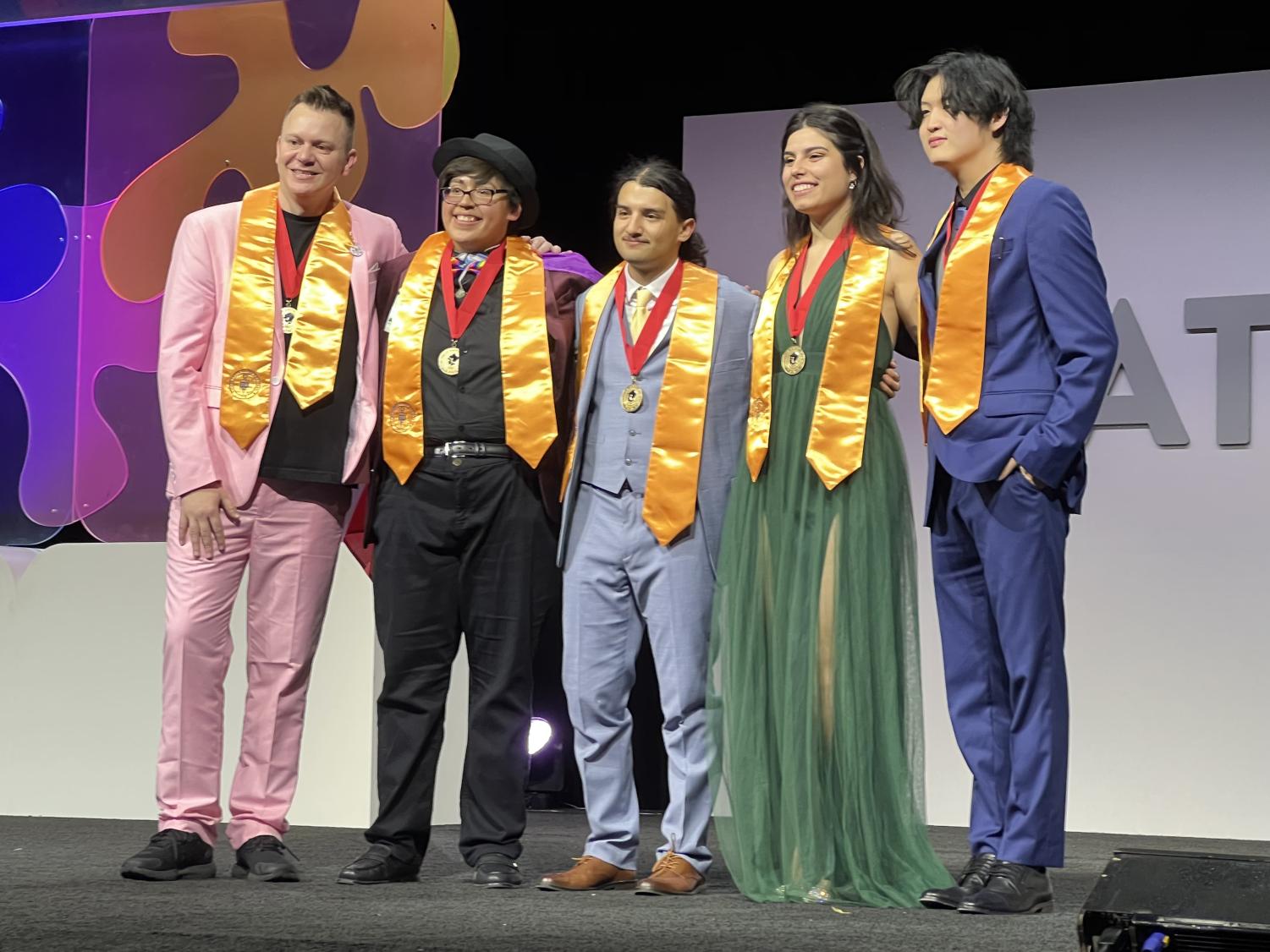 Luis Medina poses for a picture with newly elected Phi Theta Kappa officers.