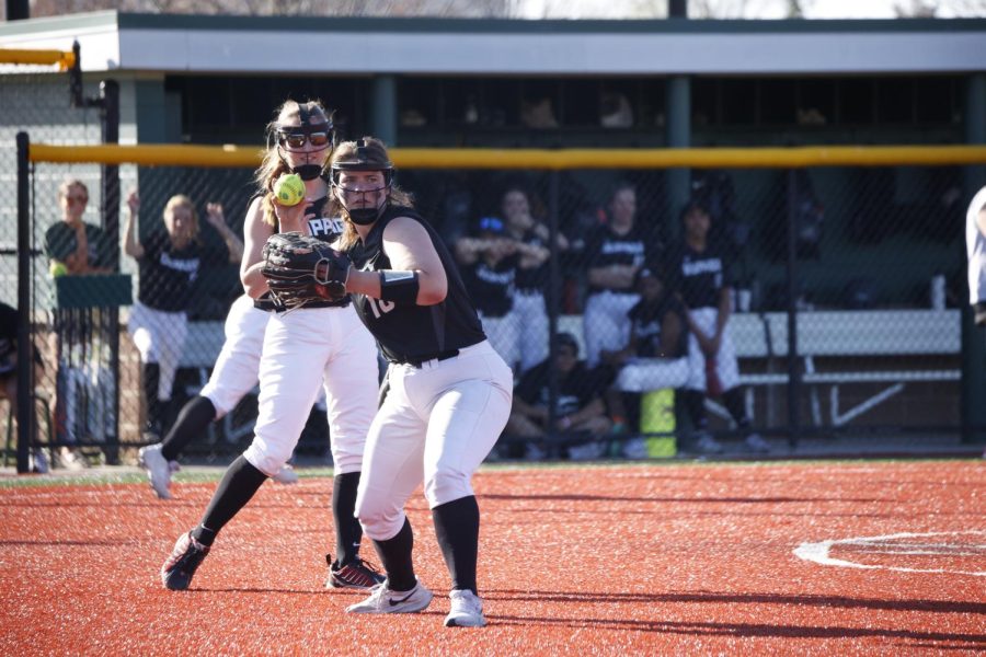 Freshman infielder Olivia Terek throws the ball to first base. 