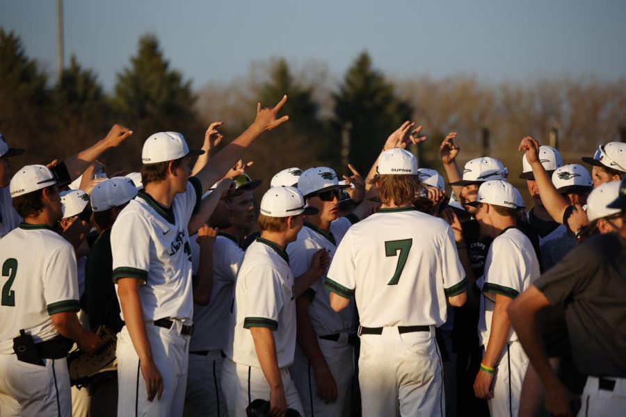 COD baseball players put their hands in the air after winning both games against Moraine Community College.