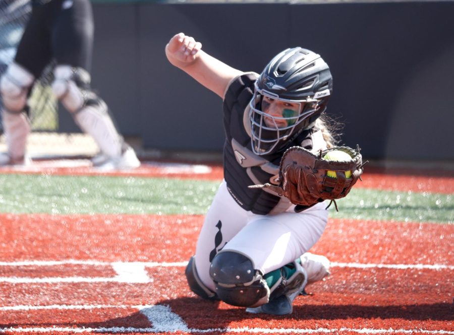 Freshman catcher and infielder Lindsey Onnezi reaches for the ball.