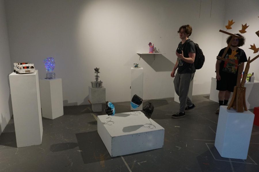 In the ceramics room, art students set up a gallery for their work.