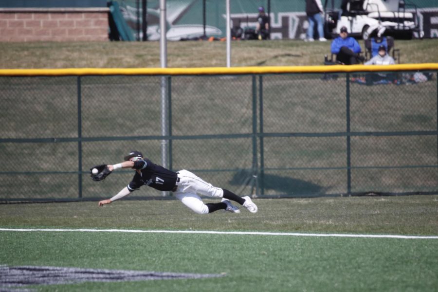Sophomore infielder A.J Taylor makes a diving catch in the outfield during the game.