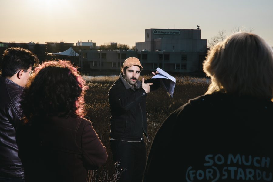 Pedro Gramaxo in the prairie with students of Sculpture class. Photo by Janine Orihuela Solis