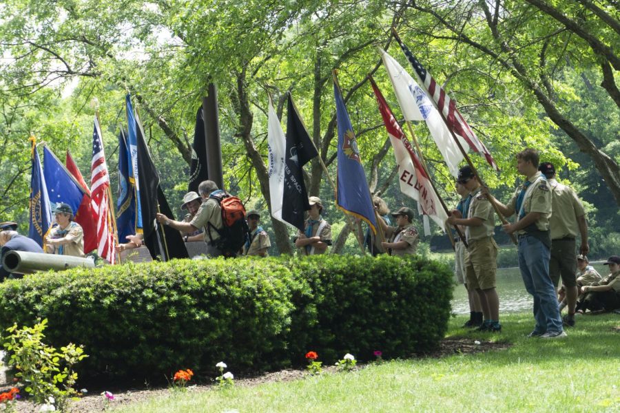 Local Scouts stand behind speakers as they give their remarks.