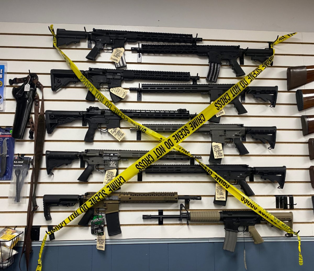 North American Firearms, a family run gun shop out of  Lombard, Ill. puts police tape over rifles thatve been banned by the Protect Illinois Communities Act. 