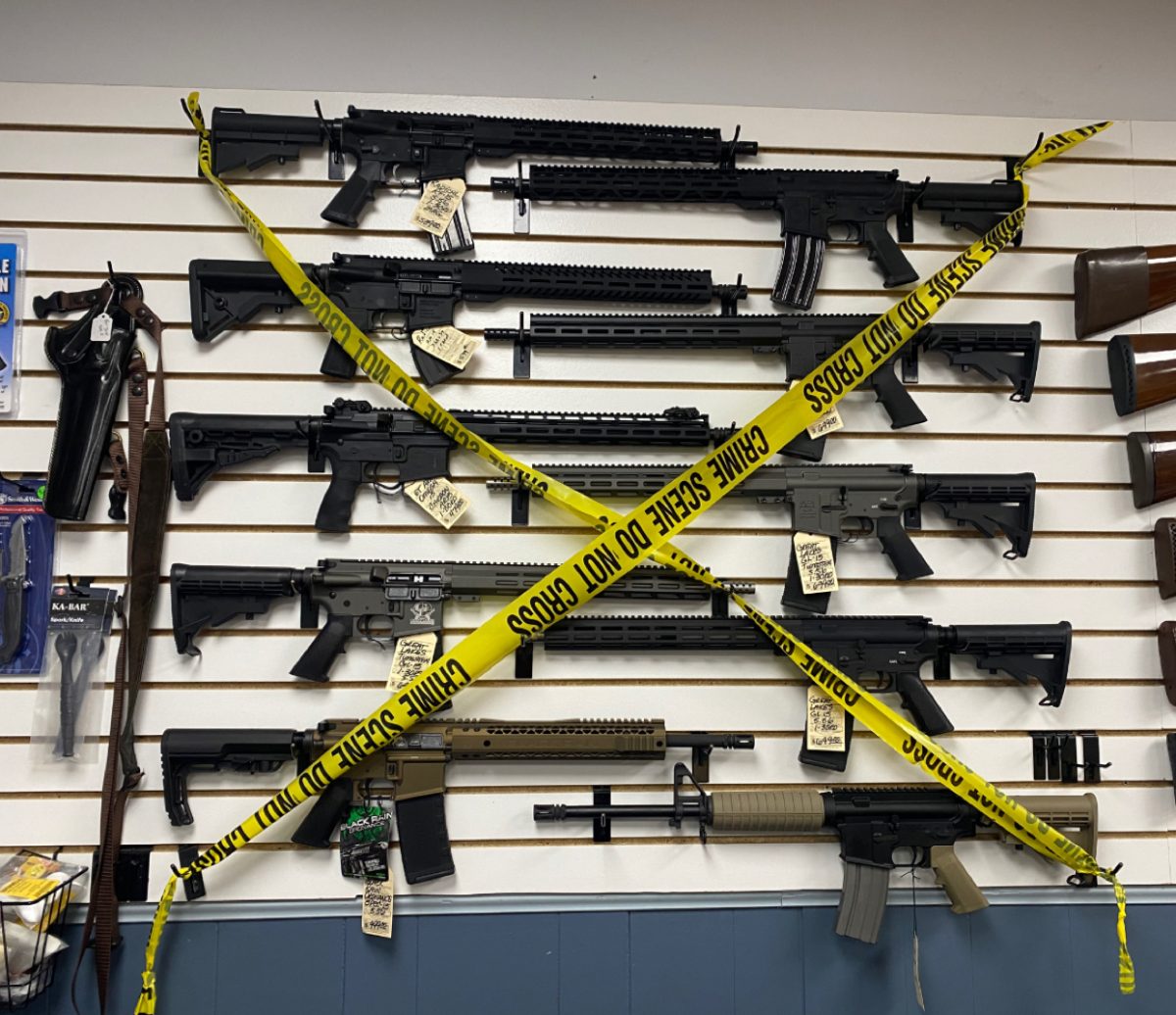 North American Firearms, a family run gun shop out of  Lombard, Ill. puts police tape over rifles that've been banned by the 'Protect Illinois Communities Act.' 