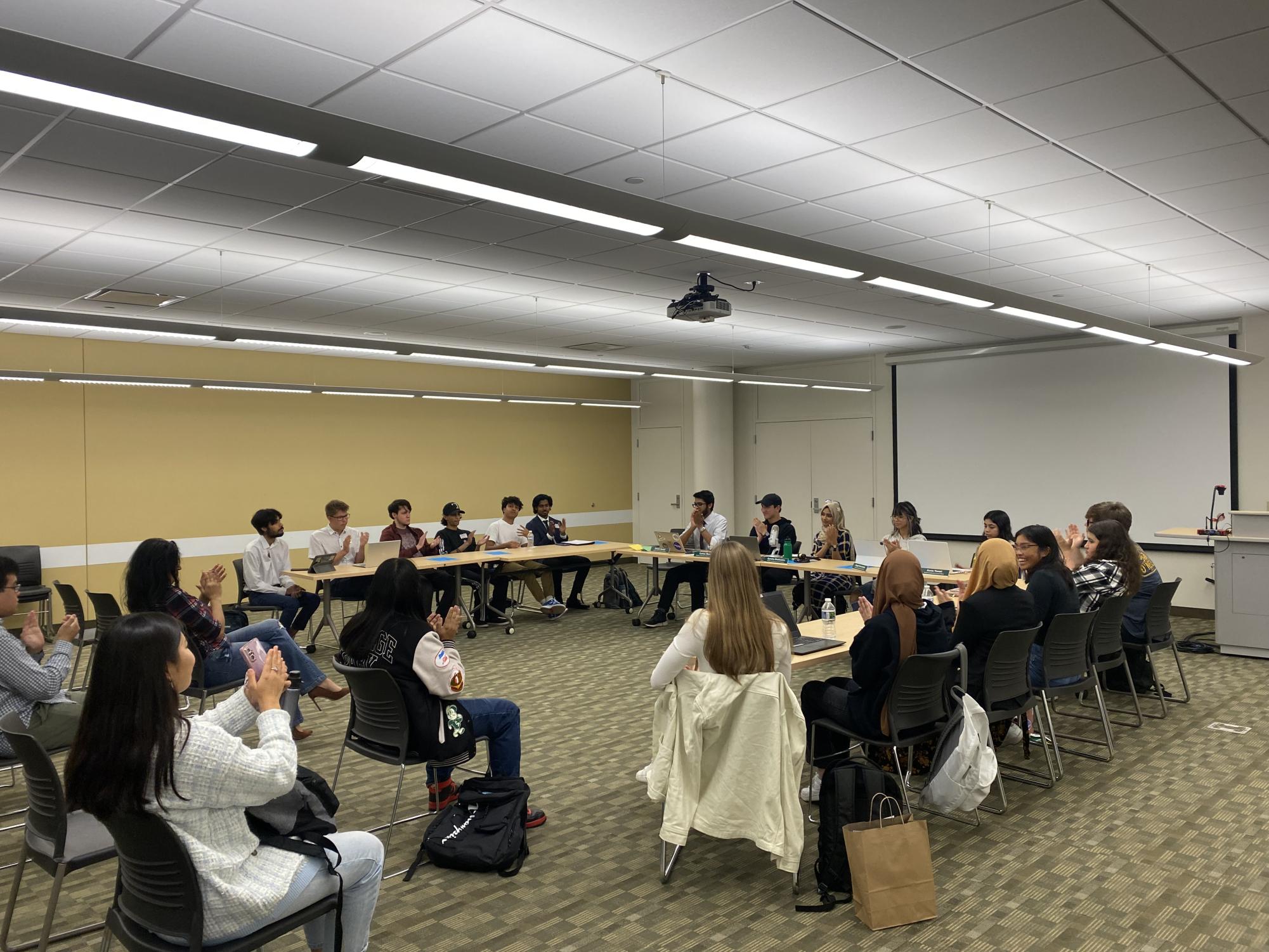 Officers of Student Leadership Council moderate candidate forum to select the next student representatives. 