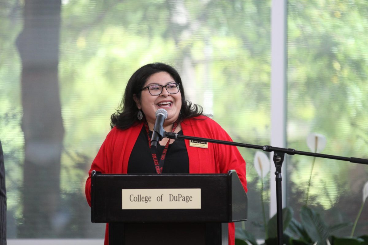 Elizabeth Gómez de la Casa, manager of the Intercultural and Latino Students Initiative, speaks during the opening ceremony.
