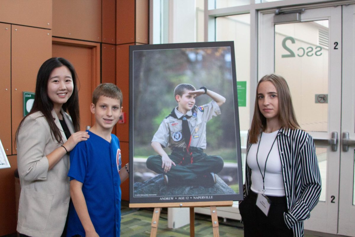 Jihyun Jung, Andrew and Oleksandra Solonenko pose for a portrait.
