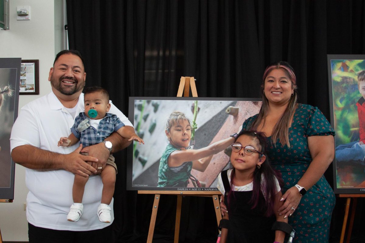 Dahlia and her family members pose for a portrait. Her photo was taken by Thomas Haslett.