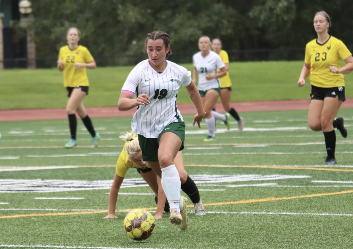 Sophomore Anna Odisho runs with the ball