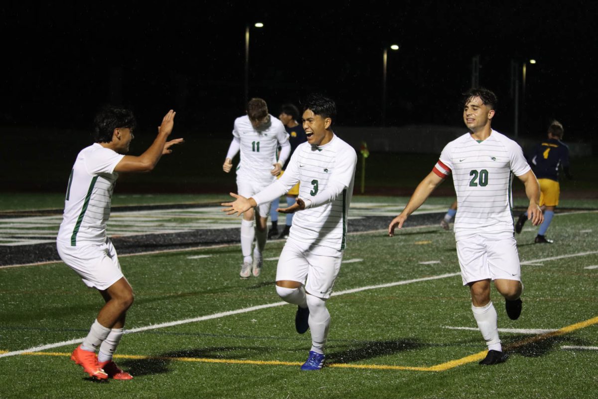 Sophomore Joseph Muana celebrates with his teammates after scoring his first career goal for the Chaparrals. 