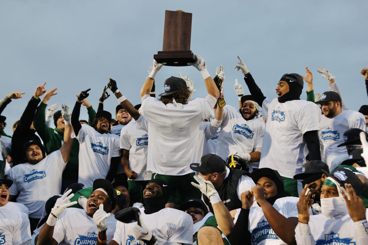 The COD football players celebrate after they won the national championship.