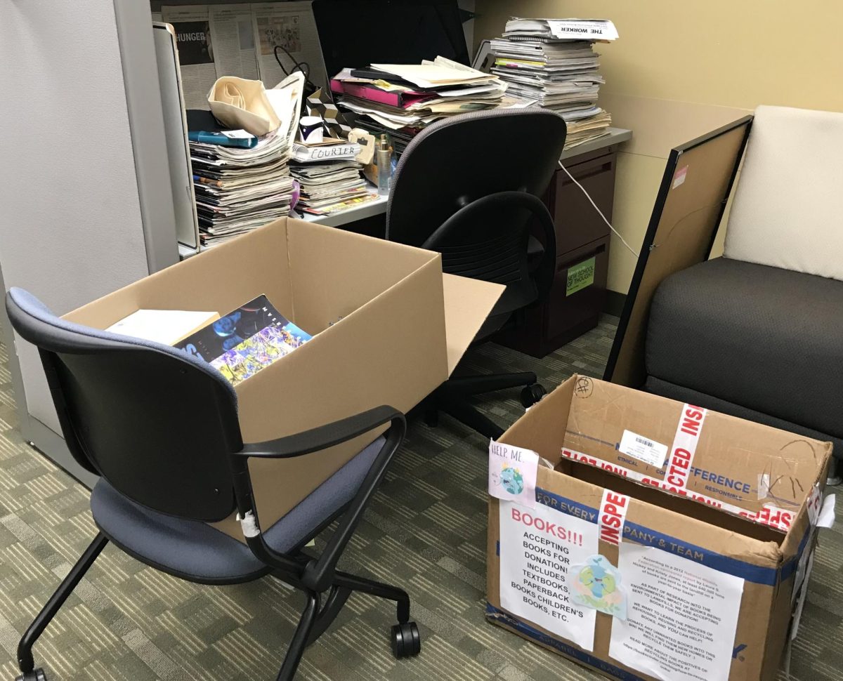 Boxes with fliers for and books collected for book drive. 