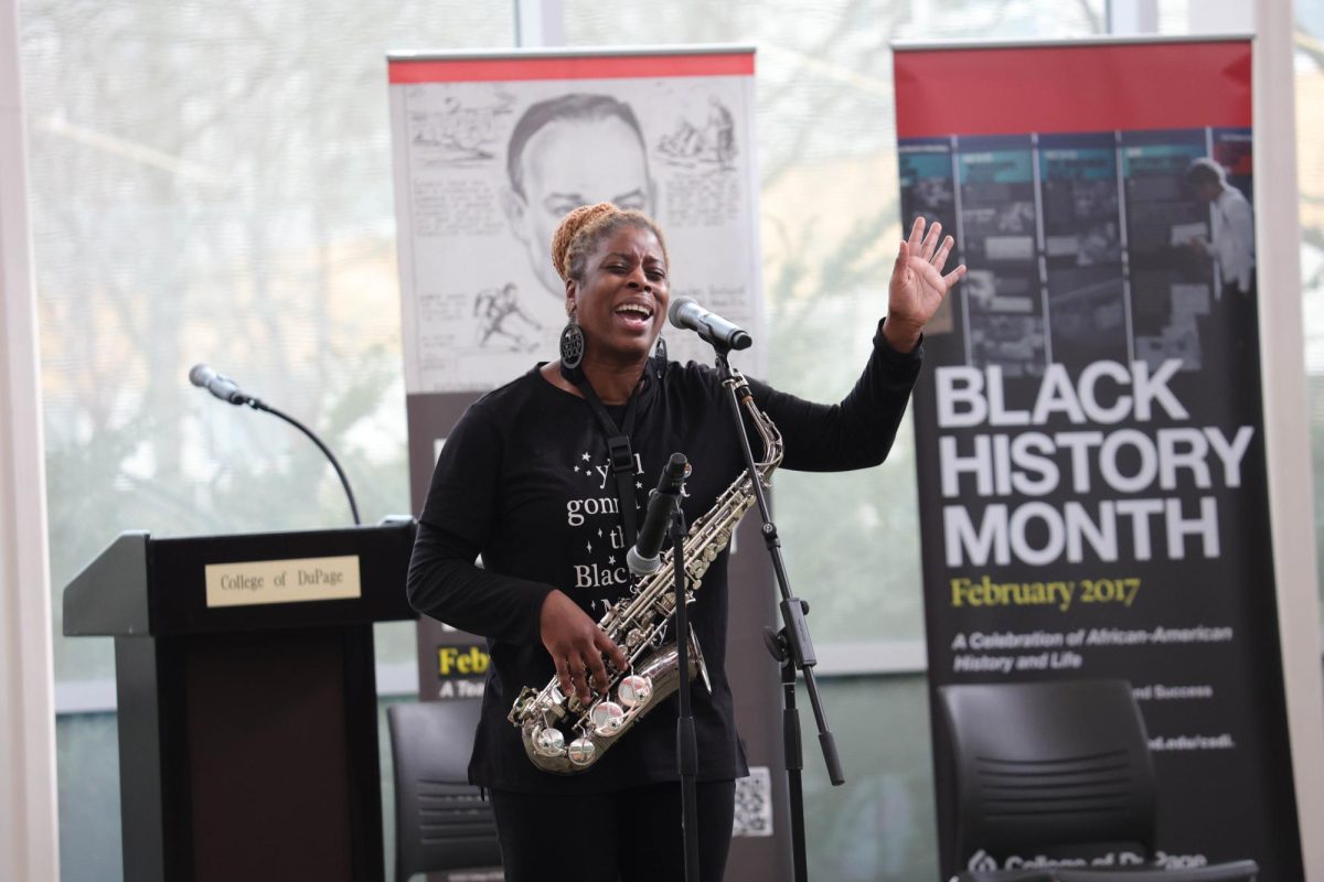 COD student Jennifer Jennings sings and plays the saxophone during the black history month opening ceremony. 