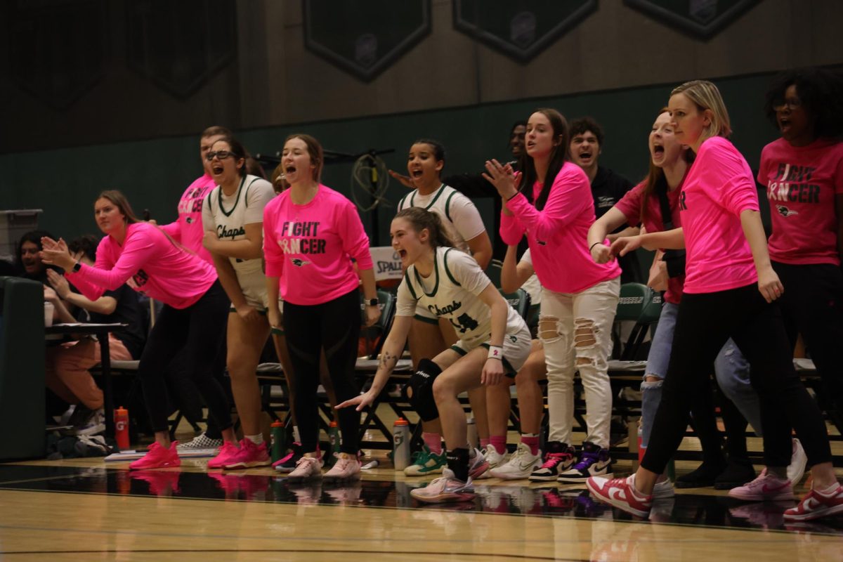 The COD womens basketball team cheers from the sidelines.