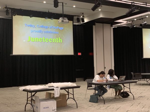 A presentational video on Juneteenth plays at CODs Open House. 