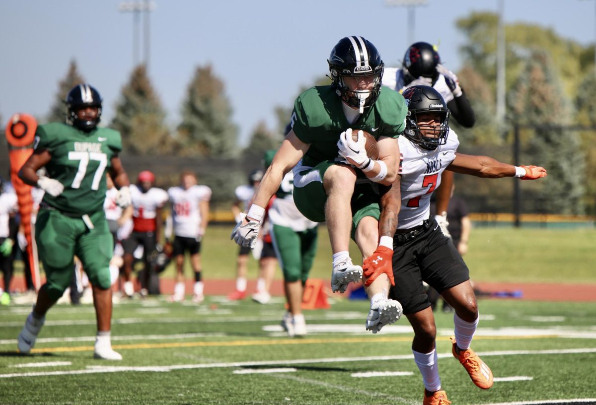 Freshman wide receiver Clayton Bone jumps into the endzone for a touchdown. 