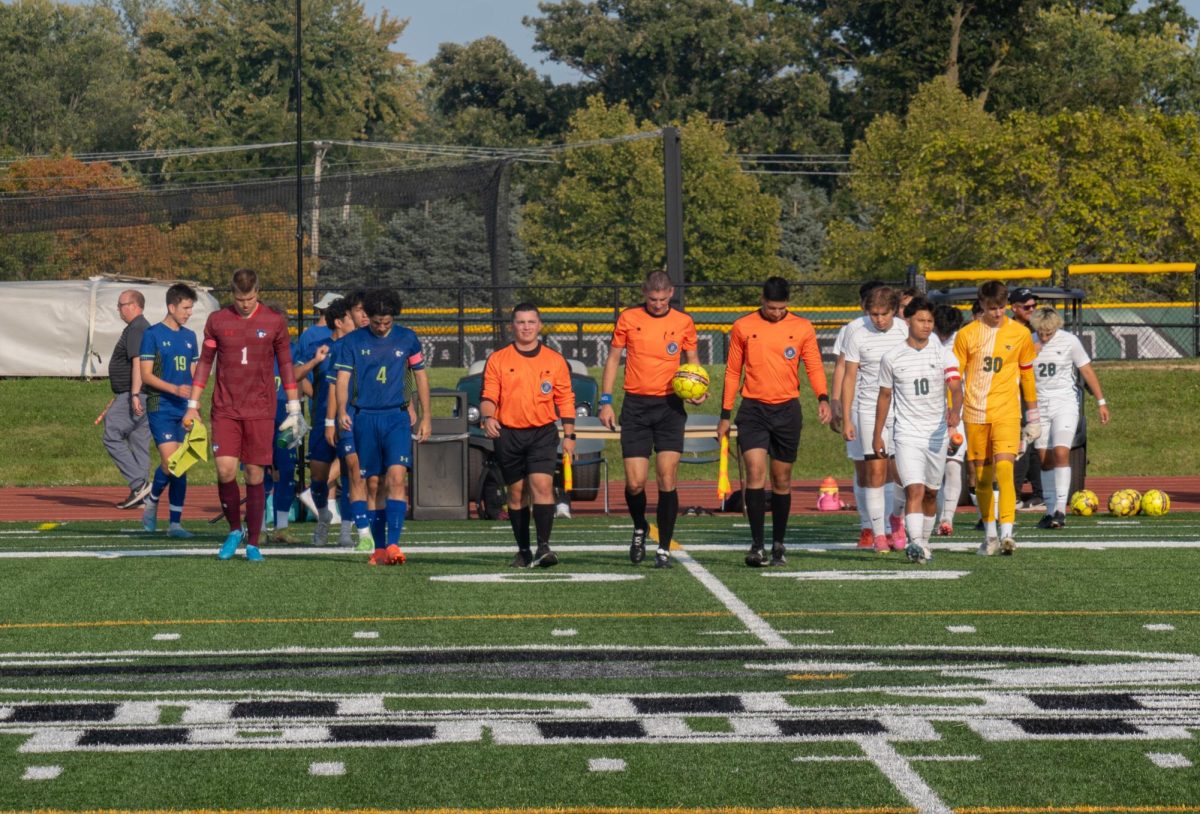 The teams walking onto the field.