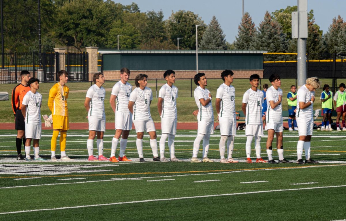 The team standing up for the national anthem.