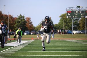 Sophomore Ernest Temple runs towards the outside to score a touchdown.