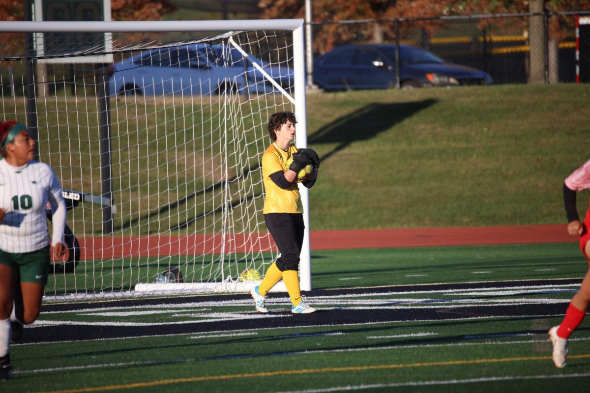 Freshman Corinne Myket makes a save. 