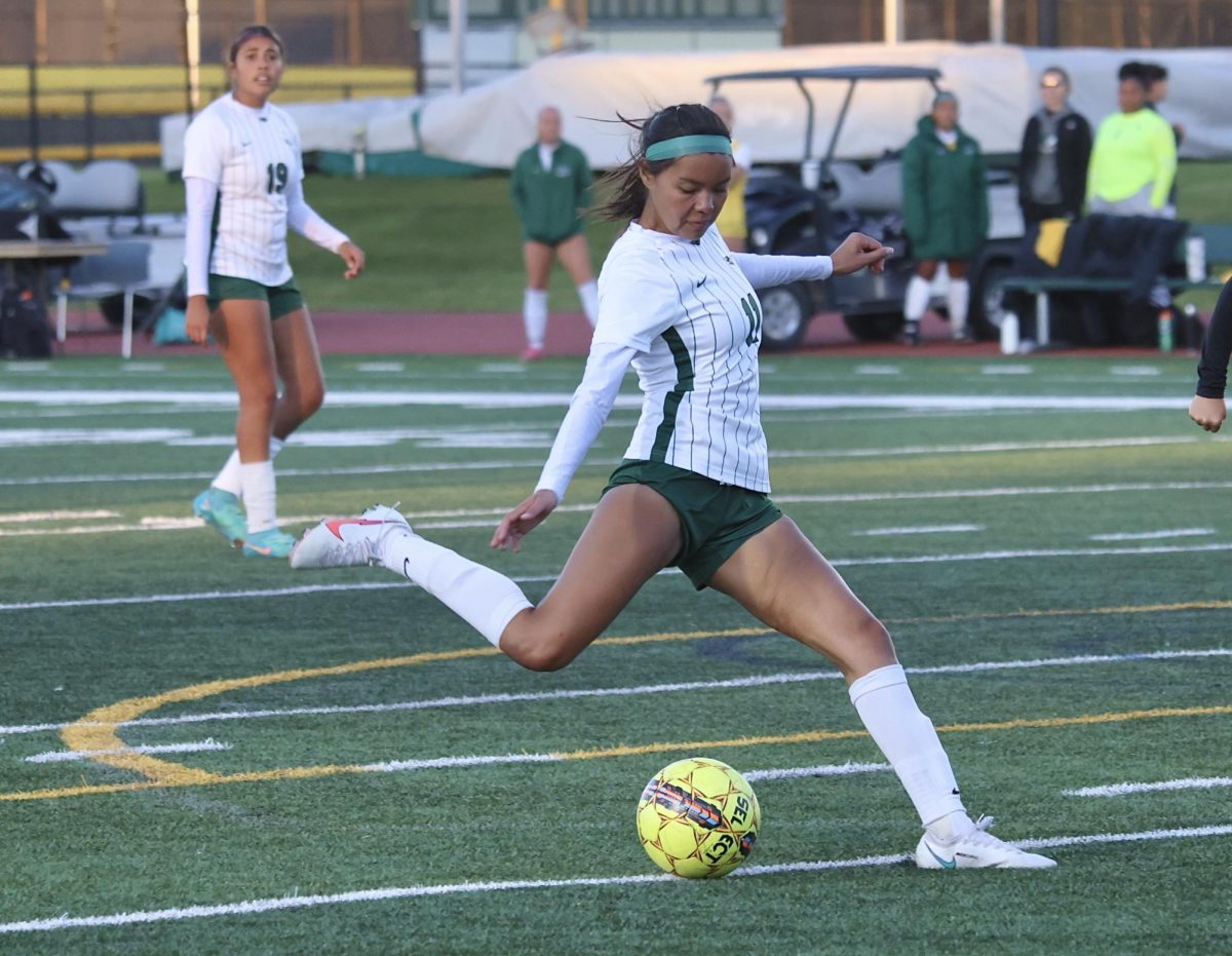 Freshman Berenice Marin attempts to score a goal. 