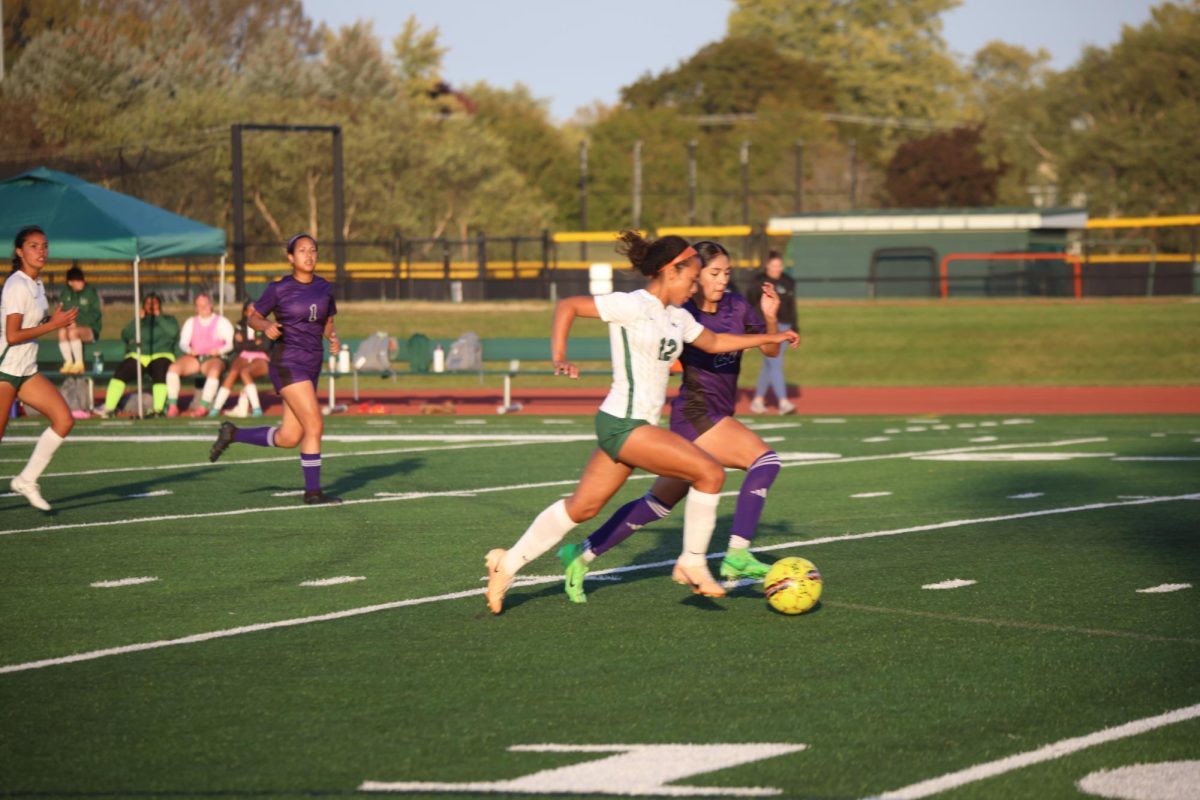 Freshman Asa Potts runs with the ball. 